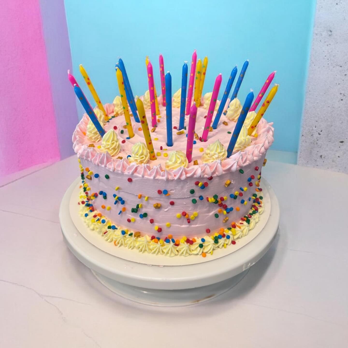 Pink lavender confetti birthday cake with candles