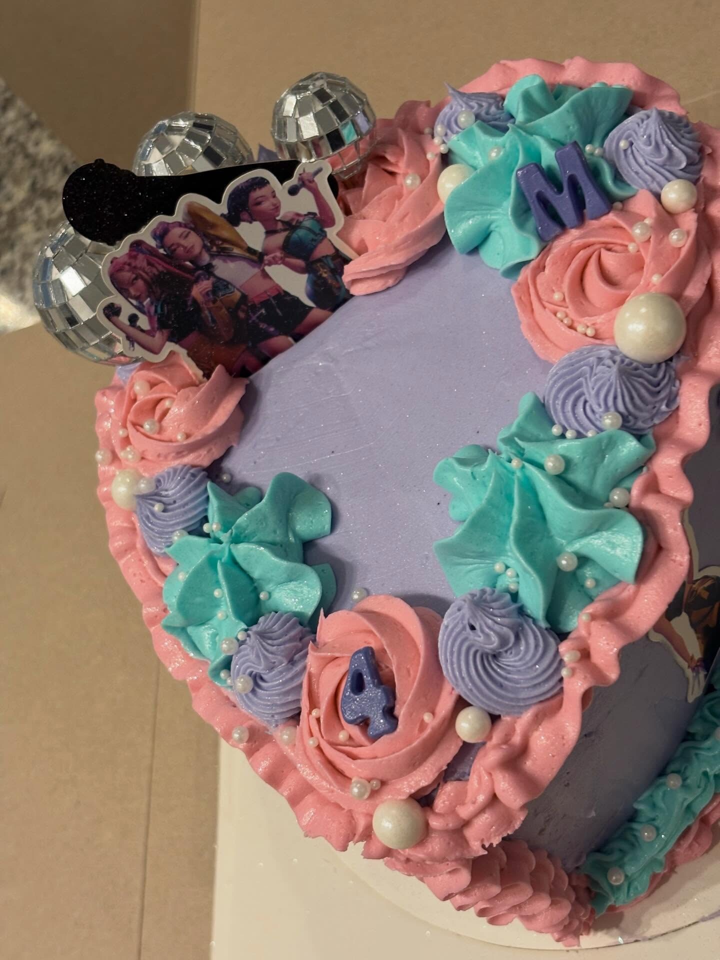 Pastel heart cake with disco balls and topper