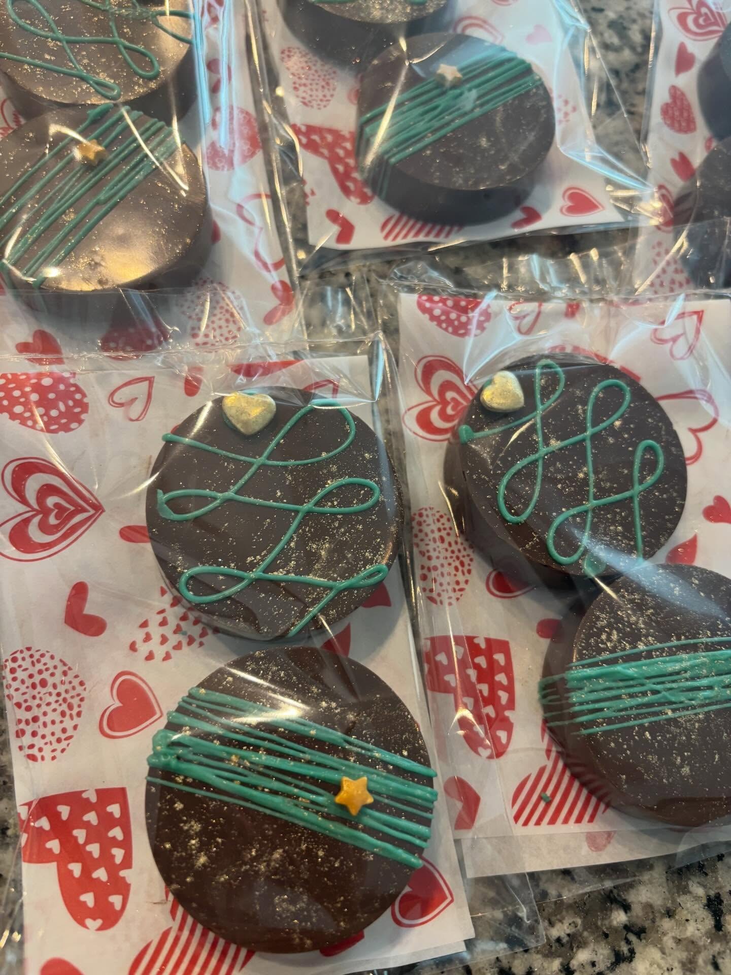Chocolate-covered Oreos with teal drizzle